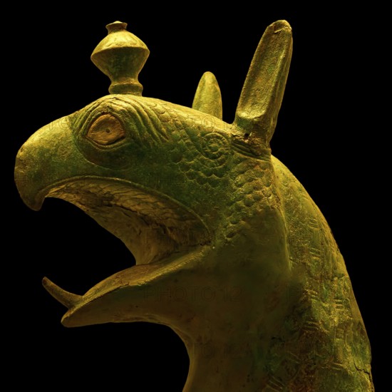Bronze griffin protome, mystical animal head sculpture made of green material with detailed design, Olympia Archaeological Museum, Ancient Olympia, Olympia, Peloponnese, Greece