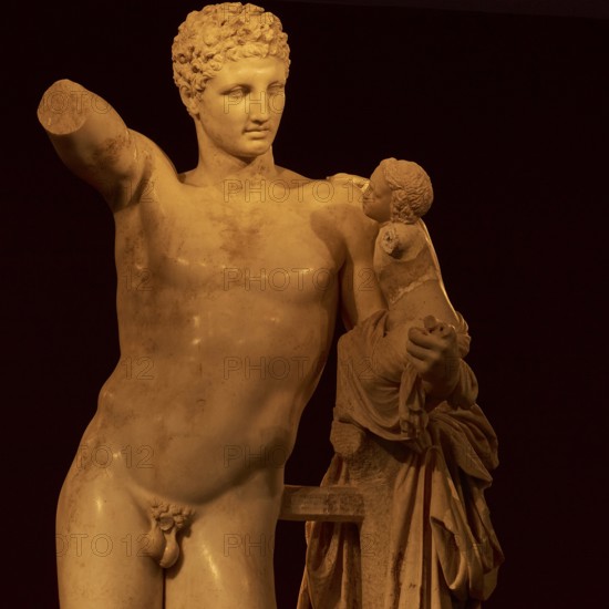 Statue of Hermes of Praxiteles, ancient marble statue of a man with a small child, partly damaged, Olympia Archaeological Museum, Ancient Olympia, Peloponnese, Greece