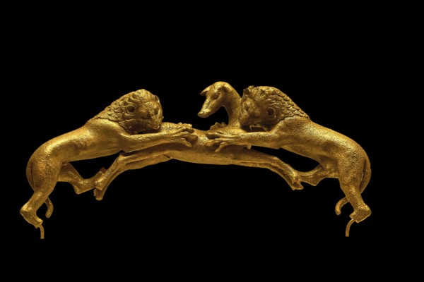 Two golden lions attacking a deer on a dark background, handle of a bronze vessel, Olympia Archaeological Museum, Ancient Olympia, Olympia, Peloponnese, Greece