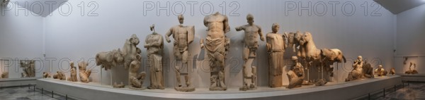 East pediment of the Temple of Zeus, preparations for the chariot race between Pelops and Oinomaos, panoramic view of ancient statues in a museum setting, Olympia Archaeological Museum, Ancient Olympia, Olympia, Peloponnese, Greece