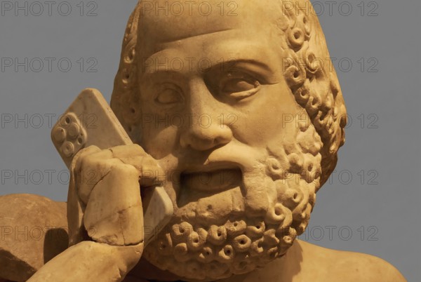 Partially AI-generated, head of the statue of the Seer, east gable of the Temple of Zeus, preparations for the chariot race between Pelops and Oinomaos, stone statue with modern smartphone in hand, interesting fusion of old and new, Olympia Archaeological Museum, Olympia, Peloponnese, Greece