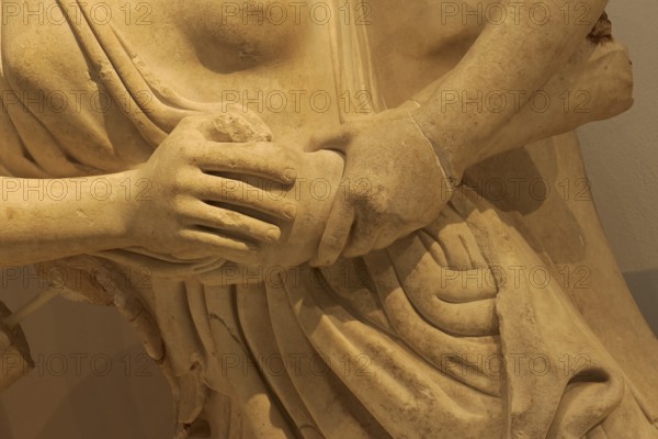West pediment of the temple of Zeus, centauromachy, close-up of an ancient marble sculpture with focus on hands and folds of the robe, Olympia Archaeological Museum, Ancient Olympia, Olympia, Peloponnese, Greece