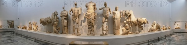 East pediment of the Temple of Zeus, preparations for the chariot race between Pelops and Oinomaos, panoramic view of an exhibition of ancient sculptures in a museum, Olympia Archaeological Museum, Ancient Olympia, Olympia, Peloponnese, Greece