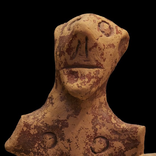 Anthropomorphic votive statuette, clay figure with abstract facial features and antique-looking patina, Olympia Archaeological Museum, Ancient Olympia, Olympia, Peloponnese, Greece