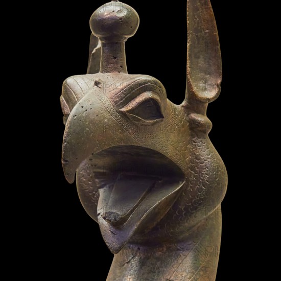 Bronze griffin protome, bronze sculptural depiction of a mythical being with stylized head, Olympia Archaeological Museum, Ancient Olympia, Olympia, Peloponnese, Greece