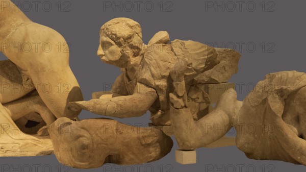 Crouching lapithin, west pediment of the Temple of Zeus, centauromachy, group of ancient stone sculptures fragmenting a historical scene, Olympia Archaeological Museum, Ancient Olympia, Olympia, Peloponnese, Greece