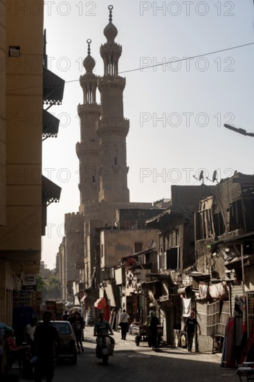 Cairo, Egypt. July 3rd 2024 Minarets of Bab Zuweila one of the historical Fatimid Gates of Islamic Cairo along busy Darb al Ahmar neighbourhood of the Egyptian capital