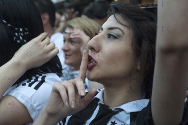 Istanbul, Turkey, May 8th 2016 Female Besiktas Carsi football supporters singing songs before a match in Istanbul, Turkey
