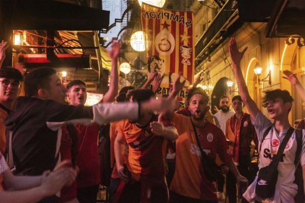 Istanbul, Turkey. October 24th 2023 Galatasaray football fans singing and chanting songs before the Champions League match against FC Bayern Munich. Nevezade near Istiklal Street, Taksim, Istanbul, Turkey