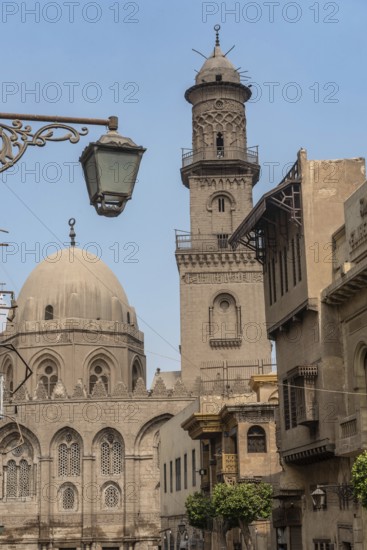 The iconic domes and minarets of the historical buildings in Islamic Cairo along Muiz street near Khan el Khalili Bazaar, Cairo, Egypt