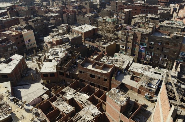 Cairo, Egypt. January 15th 2013 Residential housing in the Qaytbay neighbourhood of the Northern Cemetery known as the City of the Dead, an overcrowded suburb of Cairo, the Egyptian capital