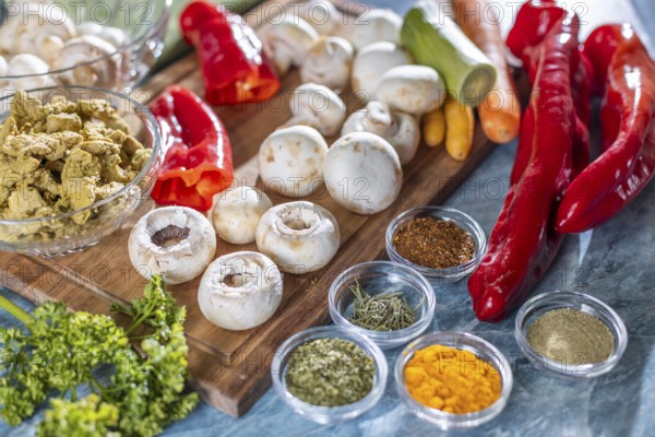 Fresh ingredients and spices such as peppers, meat substitutes, mushrooms and carrots