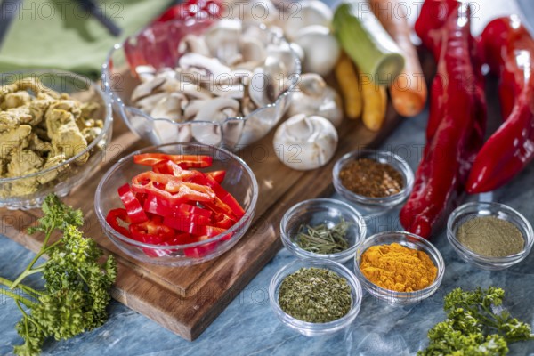 Fresh ingredients such as peppers, carrots and mushrooms in addition to spices and herbs