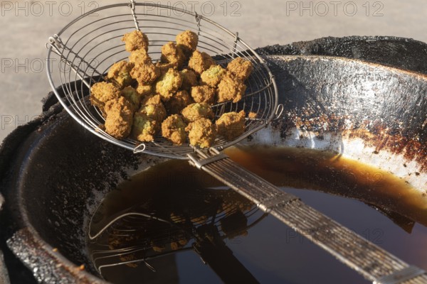 Egyptian falafel known locally as Ta'ameya and the most popular street food in Egypt and the Middle East, made from dried fava beans instead of chickpeas and eaten with pitta bread and tahini sauce