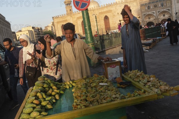 Cairo, Egypt. July 2nd 2024 A market stall holder selling prickly pear cactus fruit in the busy Islamic quarter of Cairo beside the Al Ahzar Mosque, Egypt