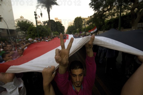 Cairo, Egypt. July 12th 2011 Egyptian anti government protestor showing the victory sign near Tahrir square, Cairo, Egypt A young Egyptian girl shows the victory sign during a protest in Tahrir Square after the Egyptian revolution on January 25th
