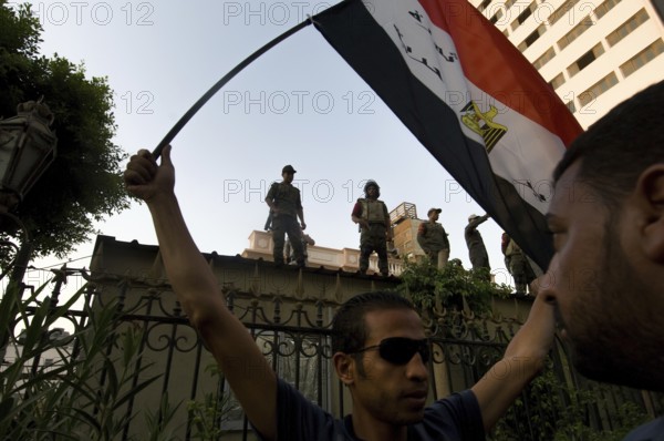 Cairo, Egypt. July 12th 2011 Protestors and armed guards outside the Shura Caouncil building, Cairo, Egypt