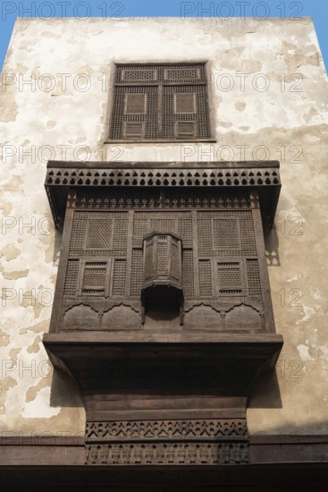 Cairo, Egypt. December 7th 2022 Traditional Arabic Islamic architecture Mashrabiya window of restored building on Darb al Asfar, al Muiz Street, Khan el Khalili bazaar, Islamic Cairo, Egypt