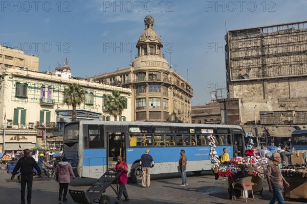 Cairo, Egypt. December 7th 2022 Busy Traffic crossing Attaba Square in front of the famous Tiring Building, an overcrowded district with a rich cultural heritage and history
