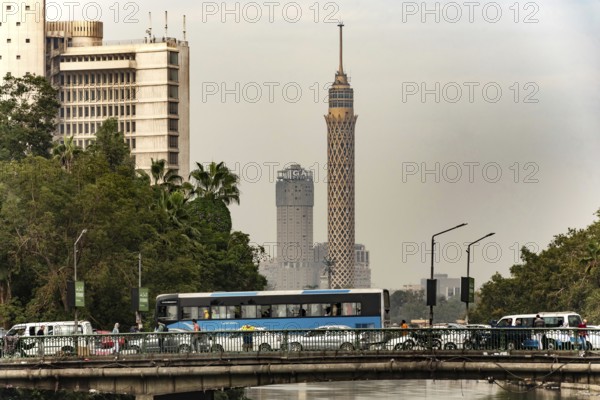 Cairo, Egypt, November 26th 2022 Egyptian commuter bus in traffic on a road bridge over the River Nile in Downtown Cairo, Egypt