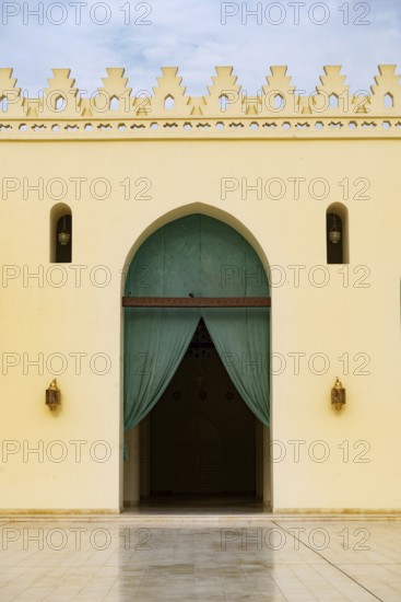 Arched doorway to the prayer hall of historic Mosque of al-Hakim, also known as Al-Anwar, named after Al-Hakim bi-Amr Allah. Just inside the Fatimid gate, Bab al-Futuh in Islamic Cairo, Egypt