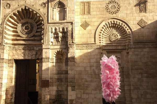 Cairo, Egypt. 18th December 2009 Cotton Candy Seller outside the Al Aqmar Mosque, Sharia Moez al Din Allah, near the famous Khan el Khalili Bazaar, Cairo, Egypt