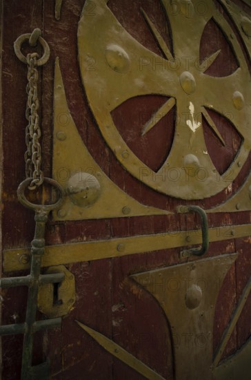 Cairo, Egypt. December 31st 2012 Egyptian Coptic Cairo, an ancient entrance door and key with Christian designs in the Old city of Egypts Christian minority