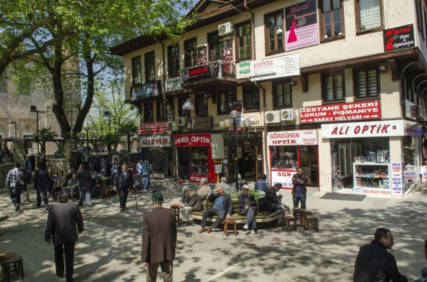 Bursa, Turkey. April 21st 2014 Older people relaxing in a tree shaded square, Bursa city, Turkey