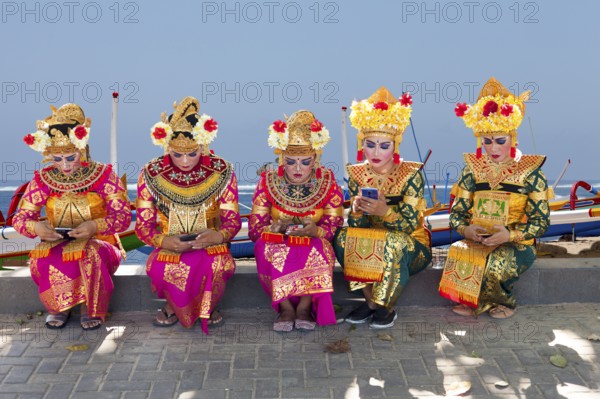 Legong dancers waiting for their performance, (background changed), Sanur, Bali, Indonesia
