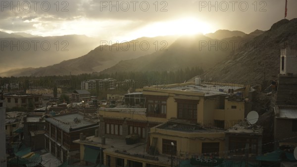 Sunset over Leh with houses and mountains in twilight, Leh, Ladakh, North India, Himalayas, India