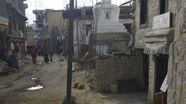 Side road in Leh surrounded by traditional buildings and cloudy weather, Leh, Ladakh, North India, Himalayas, India