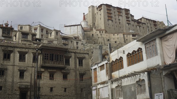Historic buildings and Leh Palace on a hill in Leh showing architectural details, Ladakh, North India, Himalayas, India