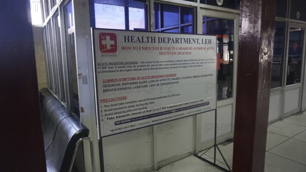 Information sign about altitude sickness at Leh airport with preventive measures in a building, Ladakh, North India, Himalayas, India