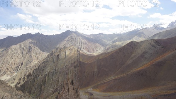 Mountain landscape with steep peaks and clear, beautifully illuminated area, trekking at Stok La Pass in Ladakh, Himalayas, India
