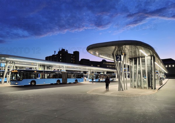 Bus station in the early morning right next to Wuppertal main station, public transport connection, North Rhine-Westphalia, Germany