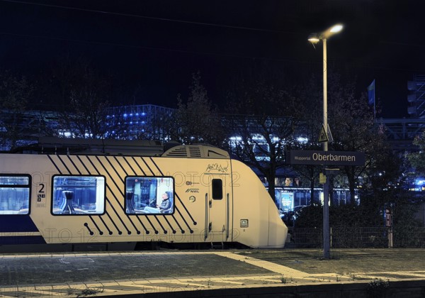 Local train at Oberbamen station at night, Wuppertal, North Rhine-Westphalia, Germany