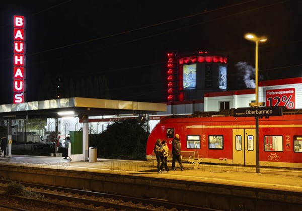 Local train at Oberbamen station with gas boiler at night, Wuppertal, North-Rhine Westphalia, Germany