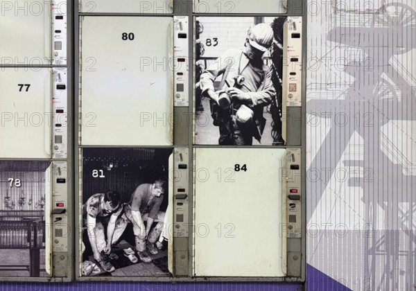 Luggage locking systems at the main train station in Gelsenkirchen designed with traditional mining motifs, Ruhr area, North Rhine-Westphalia, Germany