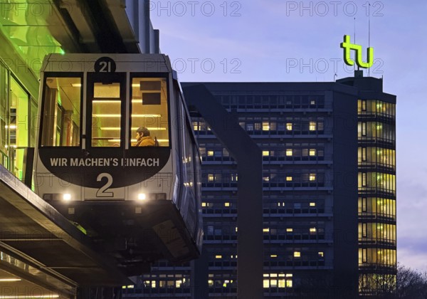 The H Bahn, an automatically controlled large cabin suspension railway in front of the Mathetower on the North Campus of TU Dortmund, Dortmund, Germany