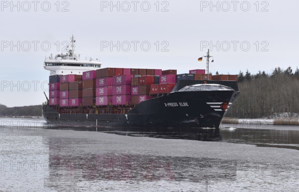 Container ship X-PRESS ELBE in the icy Kiel Canal, NOK, Kiel Canal, Kiel Canal, Schleswig-Holstein, Germany
