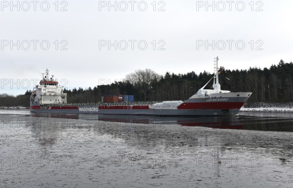 General cargo carrier LOIREBORG sails in the icy Kiel Canal, NOK, Kiel Canal, Kiel Canal, Schleswig-Holstein, Germany