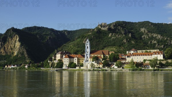 City view of Dürnstein across the Danube, with river and mountainous surroundings, Danube cycle path, Wachau World Heritage Region, Austria