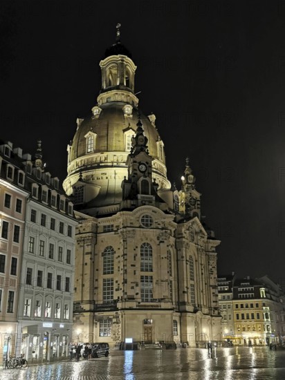 Illuminated baroque Church of Our Lady at night in the historic city center of Dresden