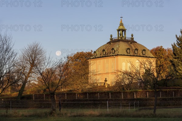 Full moon over the pheasant castle in Moritzburg at sunrise, Saxony, Germany