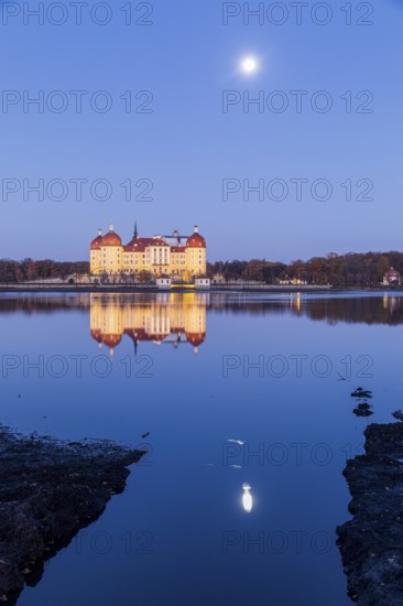 Moritzburg hunting lodge with full moon early in the morning, Meissen district, Saxony, Germany