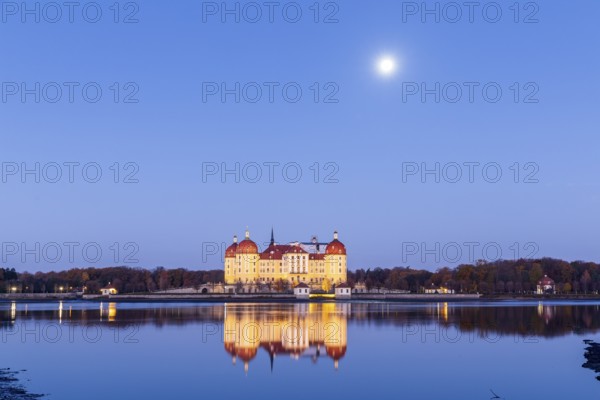Moritzburg hunting lodge with full moon early in the morning, Meissen district, Saxony, Germany