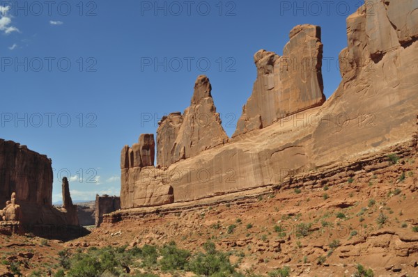 Majestic sandstone rocks, Wall Street, dominate the landscape under a clear sky, Arches National Park, Utah, USA