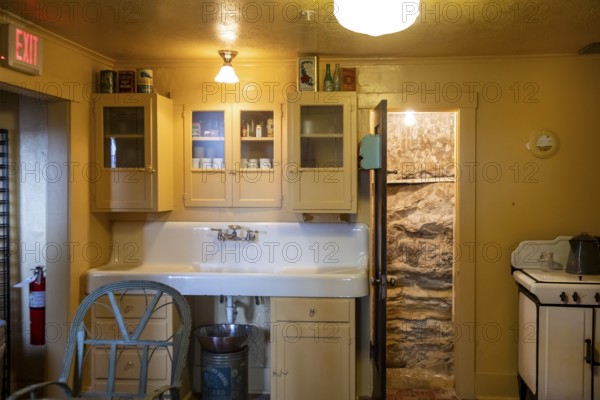 Grand Canyon National Park, Arizona - The kitchen in the historic Kolb Studio on the Canyon's South Rim. In 1903, Ellsworth and Emery Kolb established their photography studio and home here and photographed mule riders descending the Bright Angel Trail. The Canyon's rocks can be seen through the open door
