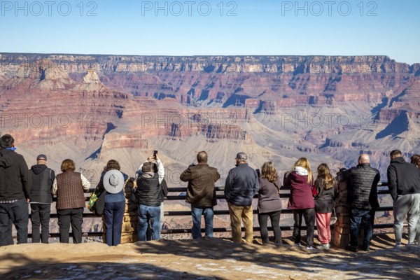 Grand Canyon National Park, Arizona. People lined up on the South Rim to view the Canyon