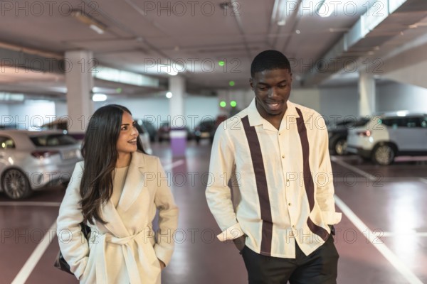 Diverse couple walking and smiling together through a modern underground parking garage after a date night, symbolizing connection, urban life, and modern relationships